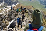 Hikers crossing a rocky ridge